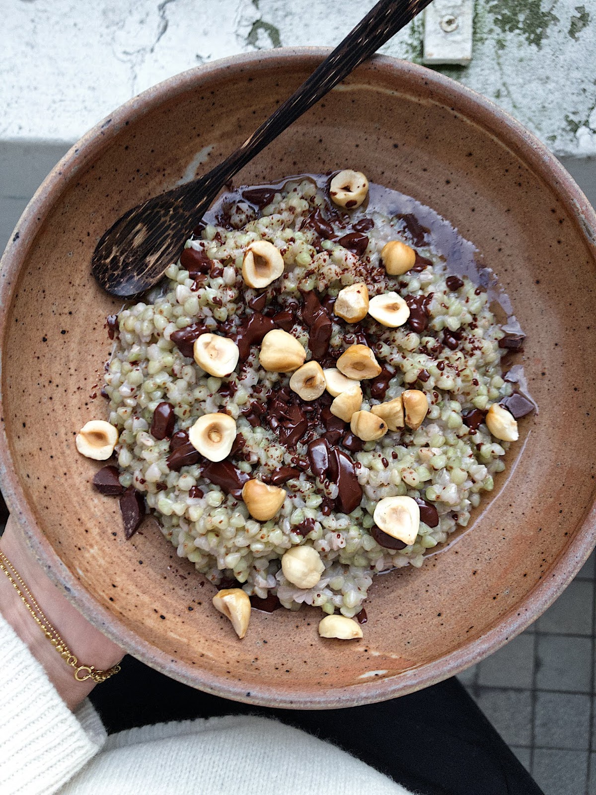 Buckwheatcoconut milk porridge with chocolate and toasted hazelnuts